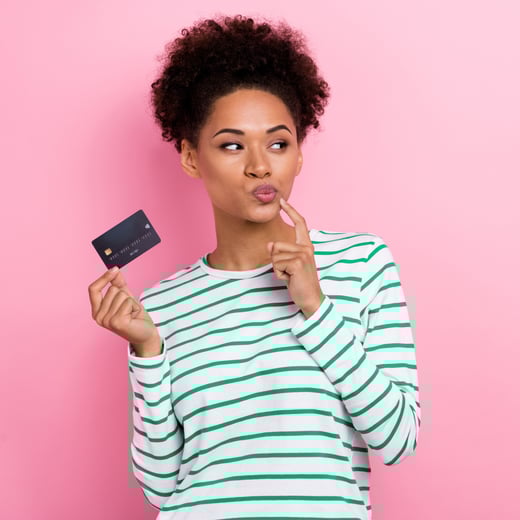 Woman thinking about credit cards